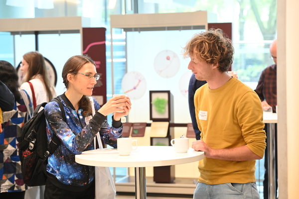 Two delegates talking at a table