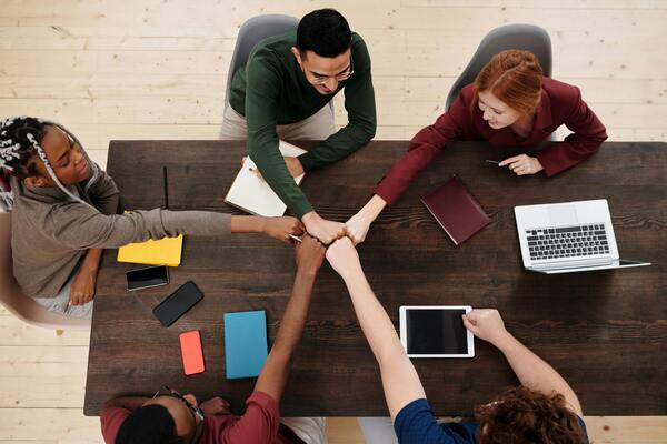 People around a table at a meeting