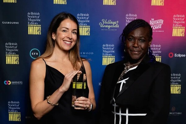Catherine de Lange holding her award together with Dame Maggie-Aderin Pocock