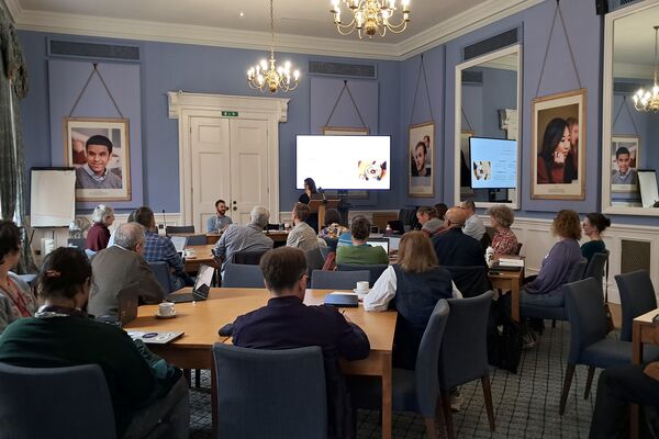 People attending a workshop in person
