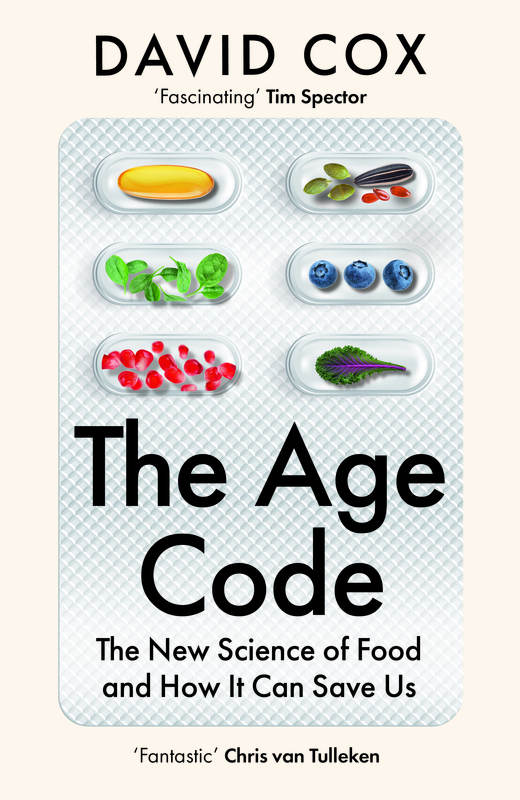 Book cover for "The Age Code" by David Cox, featuring capsules filled with various foods like spinach, pomegranate seeds, and blueberries on a textured white background.