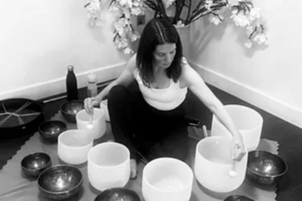 girl with crystal soundbath bowls