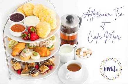 Cake stand, coffee pot and cups and text Afternoon Tea at Cafe mor