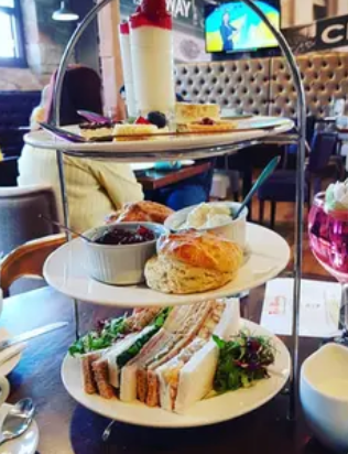 cake stand full of afternoon tea goodies