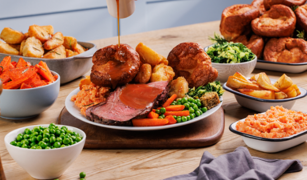 Table full of cooked sunday lunch