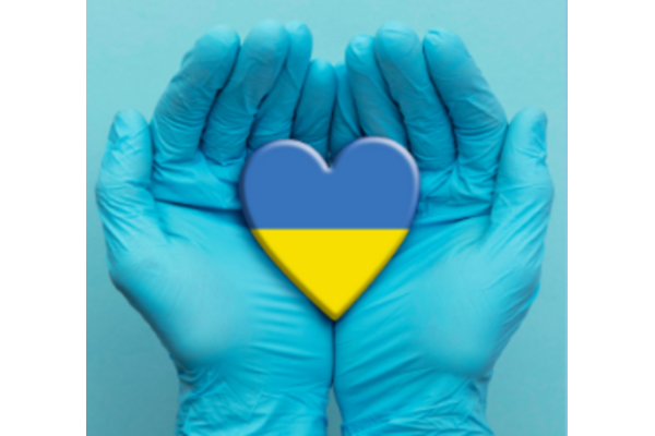 hands holding a heart the colours of Ukrainian flag