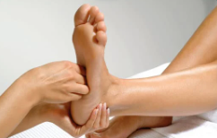 Person massaging another persons foot