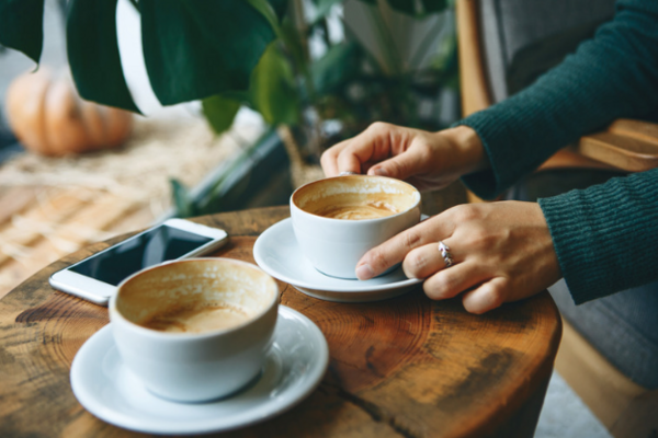 coffee cups and hands