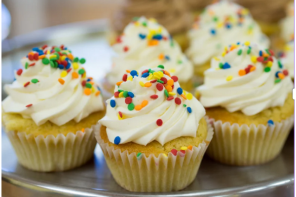 plate of cupcakes with sprinkles