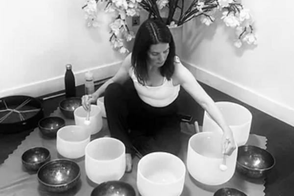 girl with crystal soundbath bowls