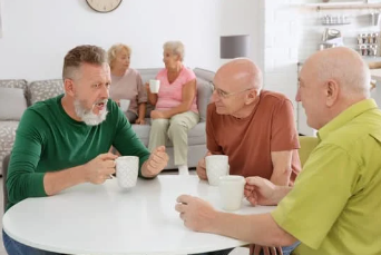 People informally chatting round table