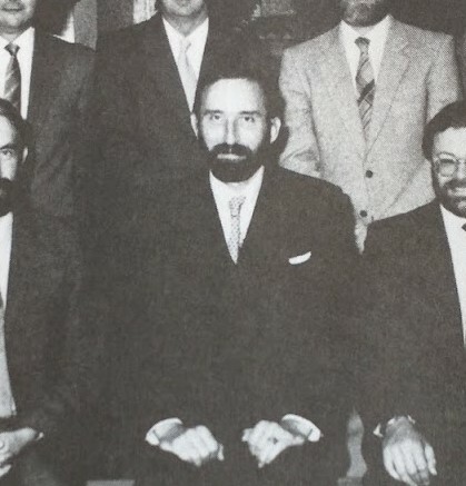 Neil Cogswell in a seated group