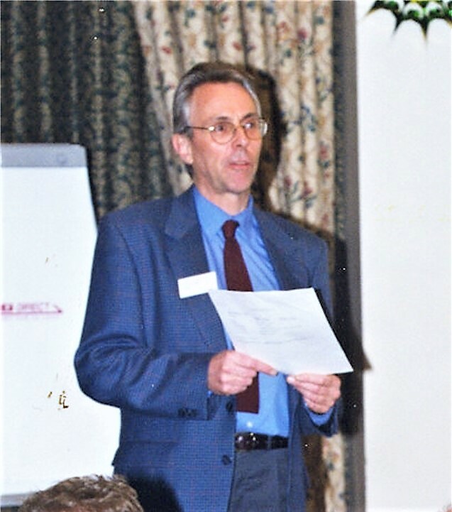Buscall presenting at a conference