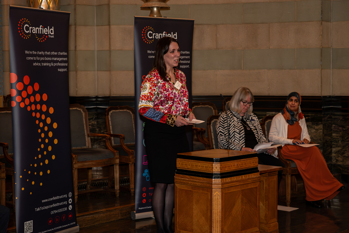 Professor Stephanie Hussels speaking on the panel at the Charity Management Matters event held by Cranfield Trust.