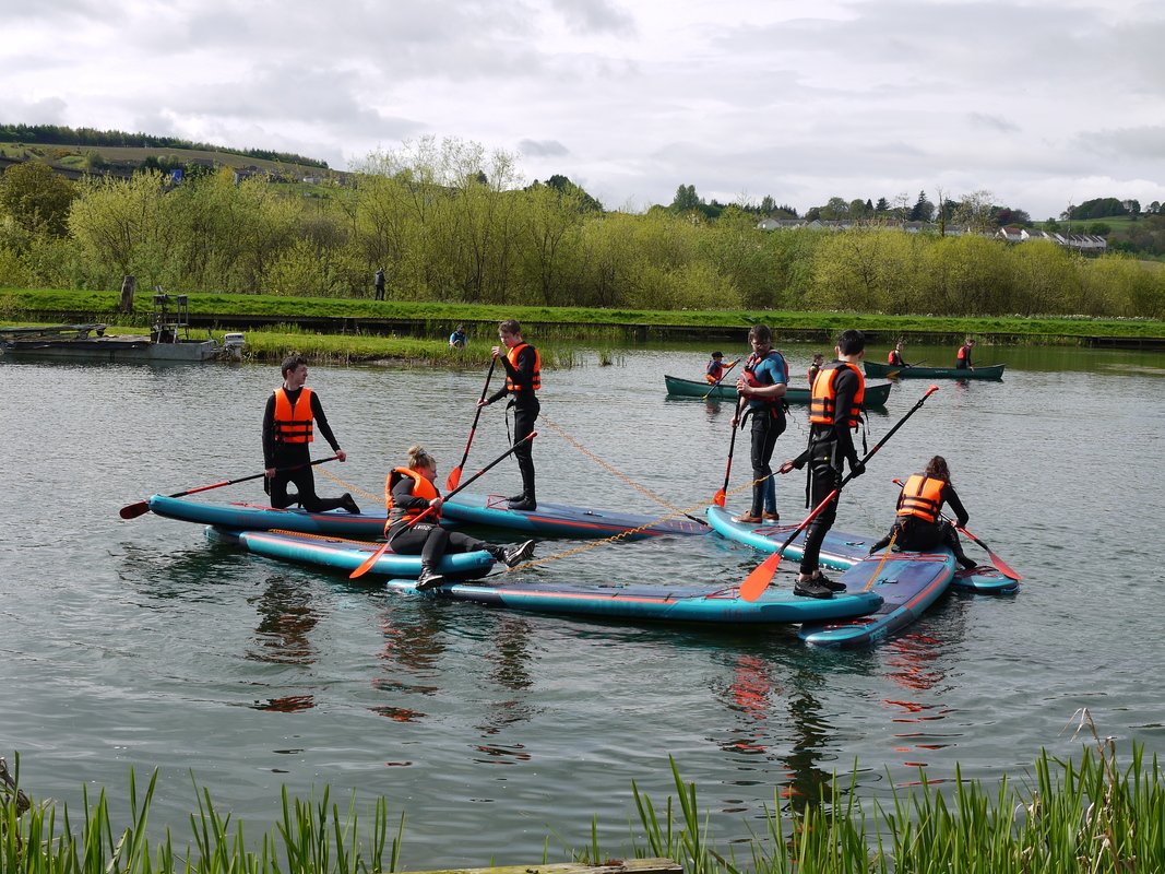 A group of young people on Kayaks