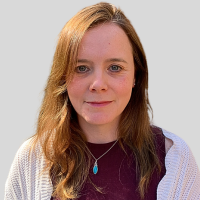 Joanne Madders - a lady with mid length brown hair wearing a cream jumper