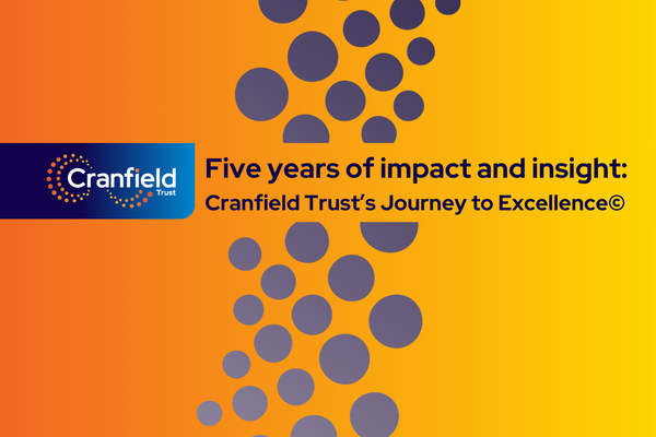 Image of the front cover of the report with the title: Five years of impact and insight: Cranfield Trust's Journey to Excellence. The words are navy on a graduated orange to yellow background. 