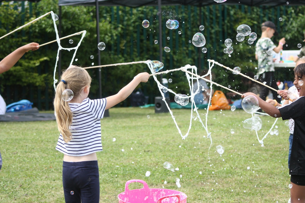 Children playing with bubbles