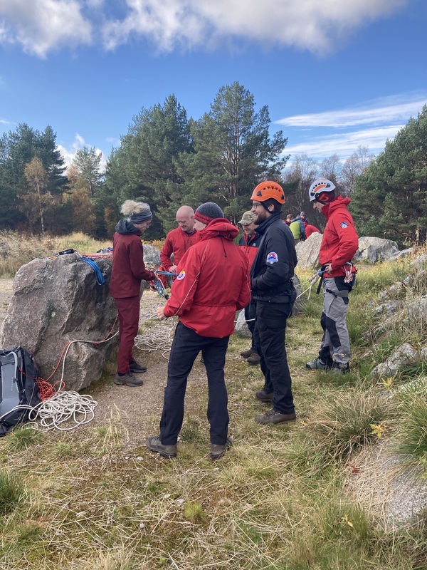 Mountain rescue team gathered in grassland