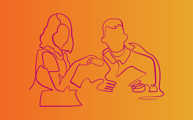 two people sat working together