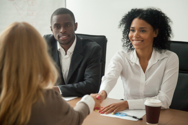 Smiling people in pro bono charity consultancy meeting