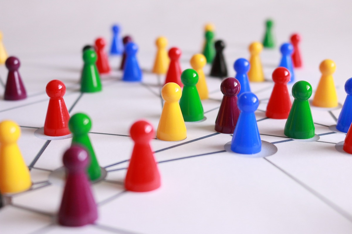 Multicoloured game counters connected with lines