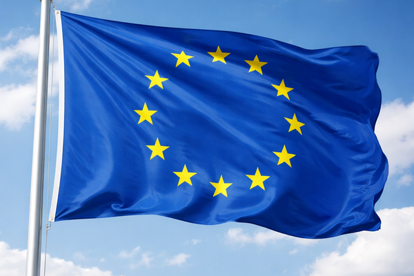 European flag waving in blue skies