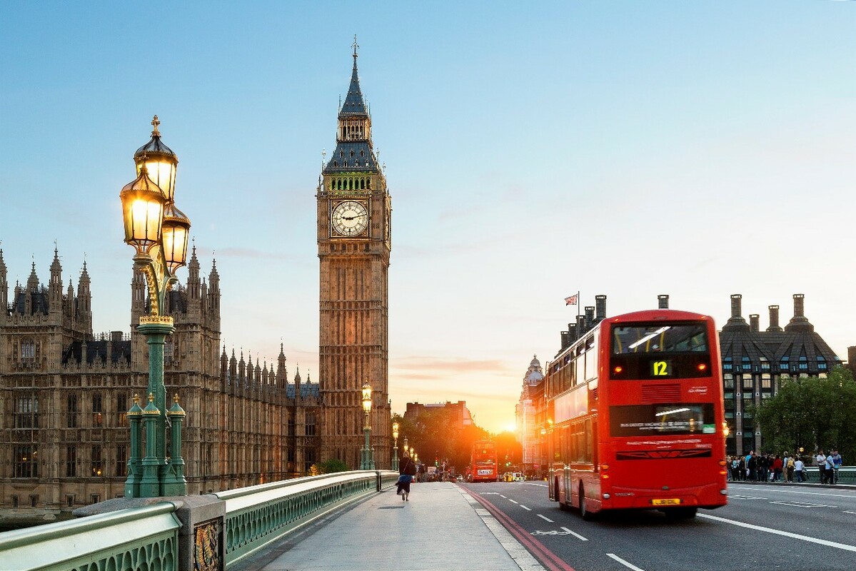 A picture of a bus crossing westminster bridge with Big Ben in the background