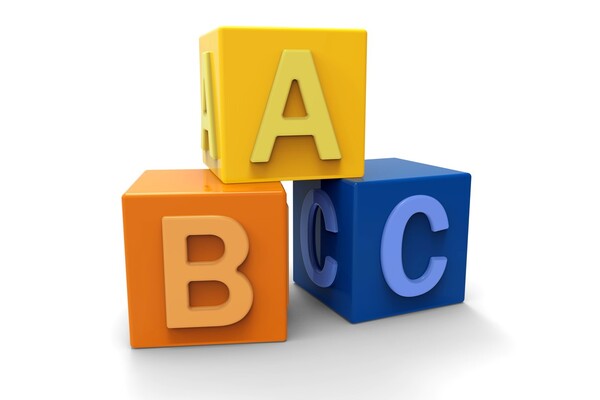 Three wooden blocks with the letters A, B and C on them