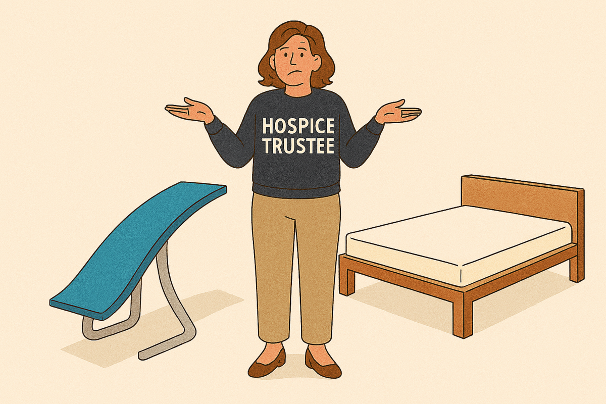A woman wearing a jumper saying 'Hospice Trustee' standing between a bed and a springboard, with a quizzical look on her face. 