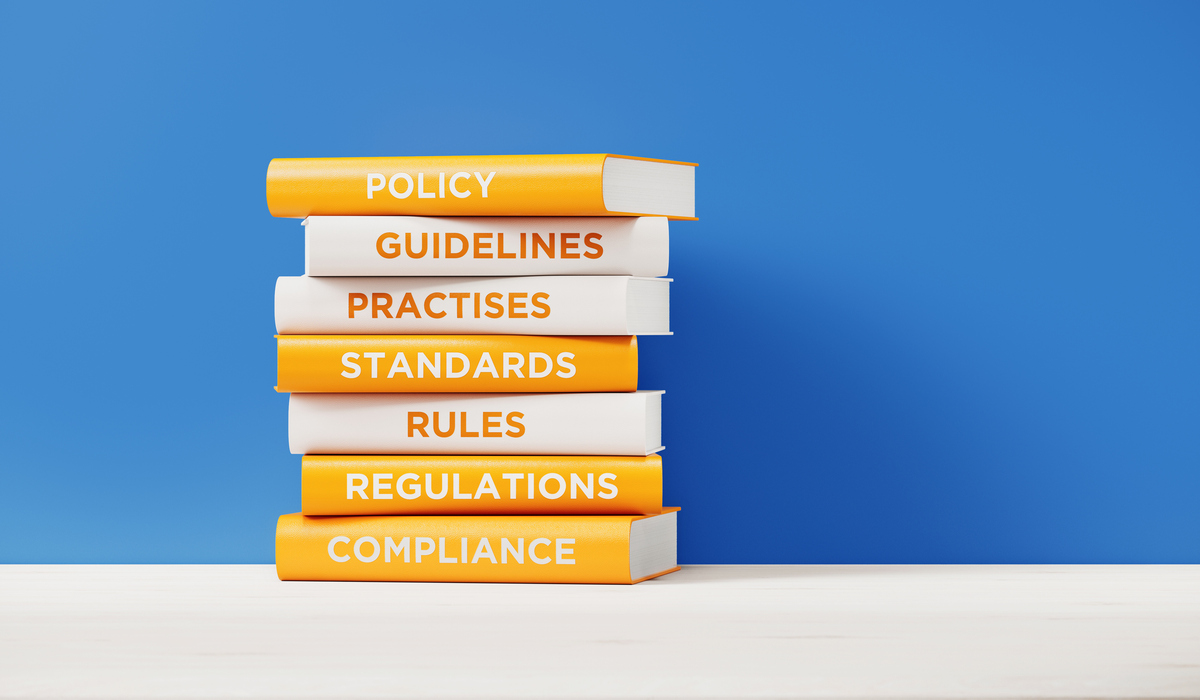 A pile of books all with titles related to governance 