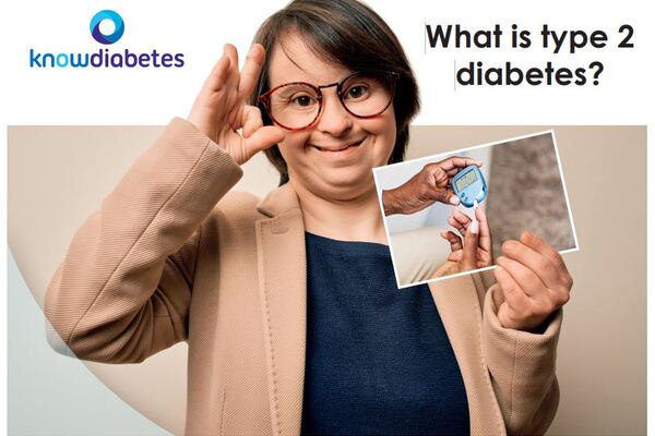 The image shows someone, wearing glasses, holding their right hand up, whilst in their left hand they have a leaflet with a picture of someone holding a diabetes monitor.