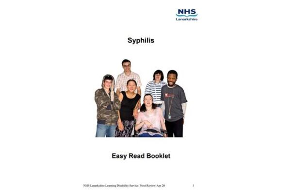 The image shows 5 people standing up and one person in a wheelchair 