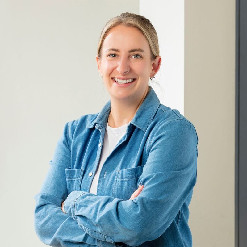 Sophie smiling wearing a blue shirt