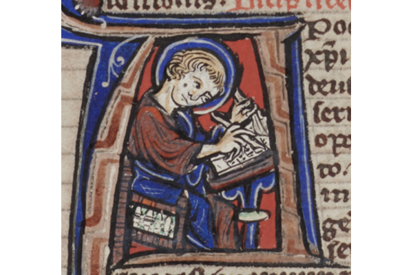 Sarum Master Bible, folio 585r. Apocalypse, with initial of St John as a medieval scribe, writing his Revelation.