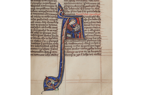 Sarum Master Bible, folio 585r. Apocalypse, with initial of St John as a medieval scribe, writing his Revelation. Image courtesy of Salisbury Cathedral.