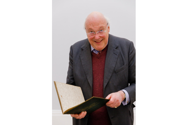 Charles Sebag-Montefiore holding a book