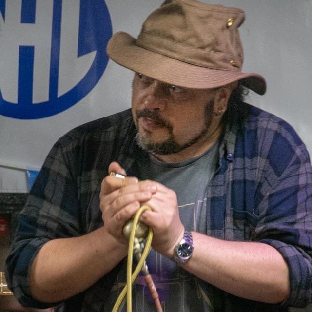 Image: Barry playing harmonica with a microphone