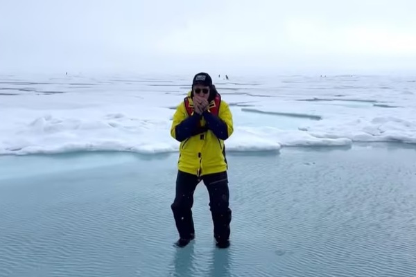 Mike Stevens playing Harmonica at the North Pole