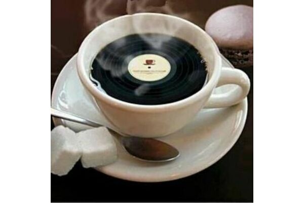 Cup of coffee with vinyl record instead of coffee