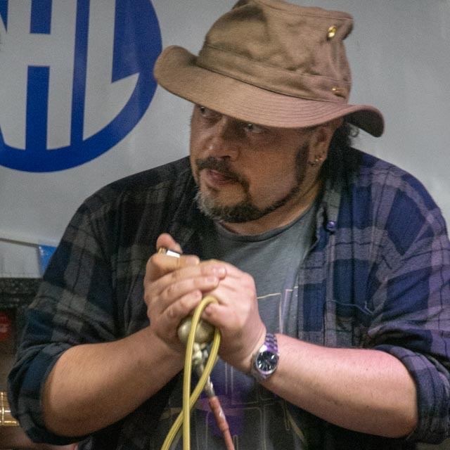 Barry playing harmonica with harp mic