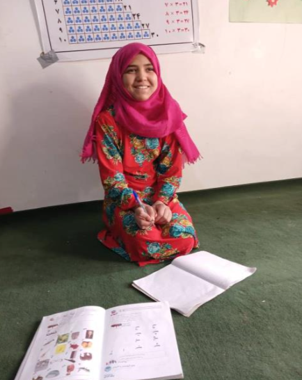 Zainab at literacy class in Kaldar