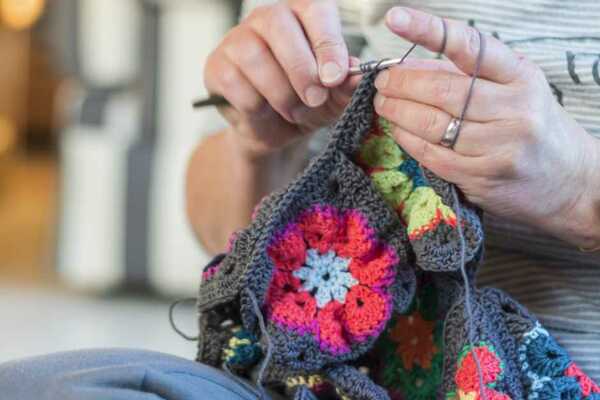 young woman enjoying crochet