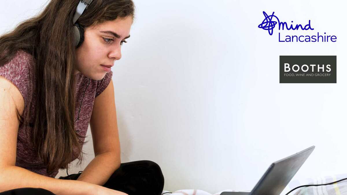 young girl on laptop listening to virtual wellbeing coach