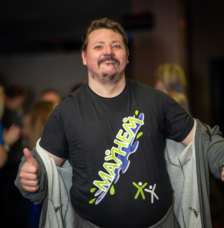 A clubber wearing a Mayhem t-short and giving a thumbs up