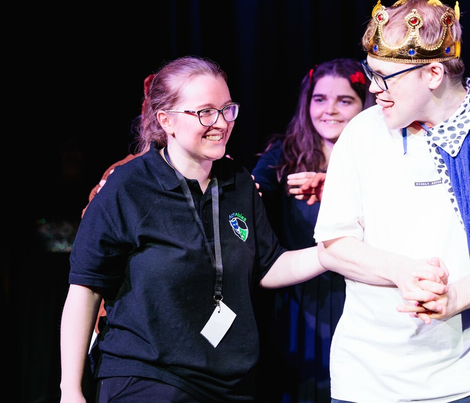 Two young people performing on stage 