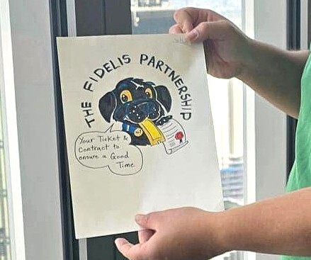 A close up of a drawing of a dog with the caption, The Fidelis Foundation.