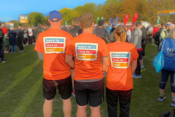 3 runners at Royal Parks Half Marathon in Learn to Love to Read T shirts