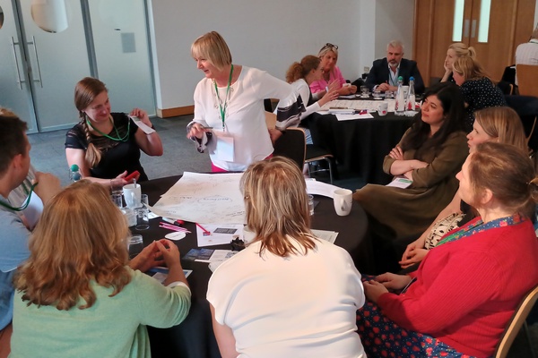 image of delegates in discussion during the world cafe session NICEC conference 2024