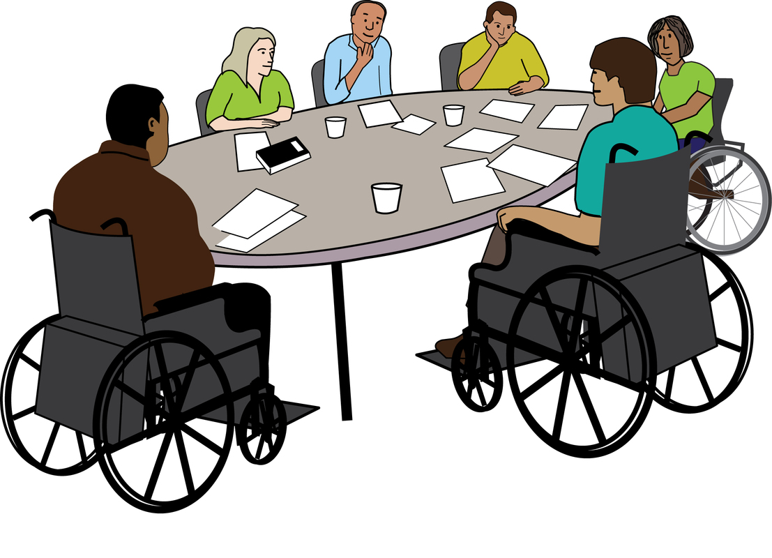 A group of people sat around a table with meeting papers in front of them